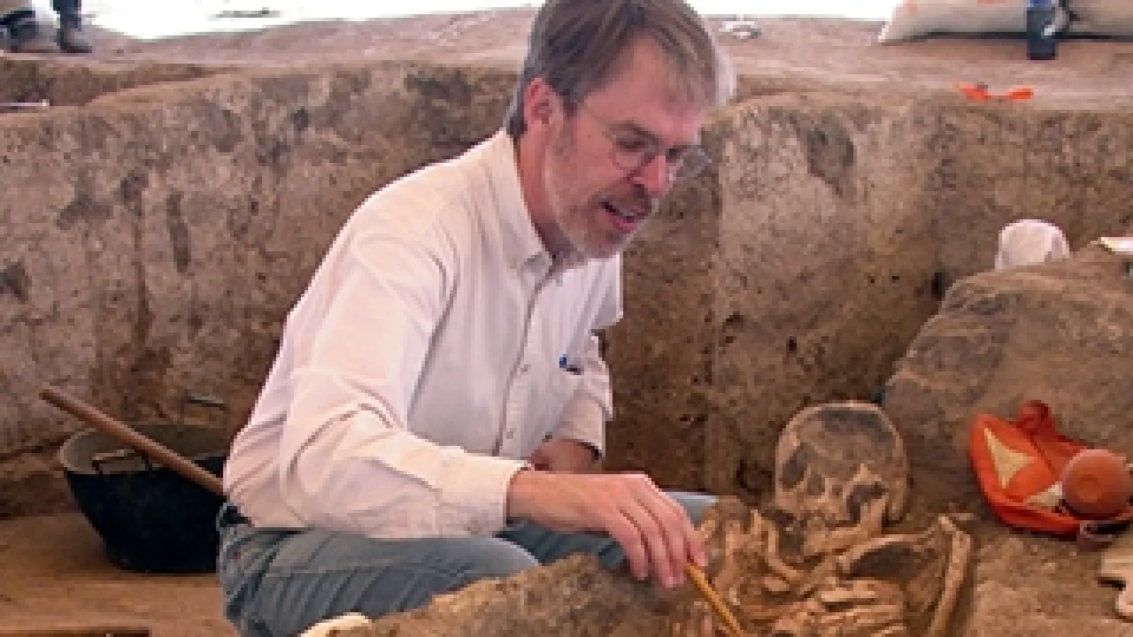 Larsen excavating a skeleton 
