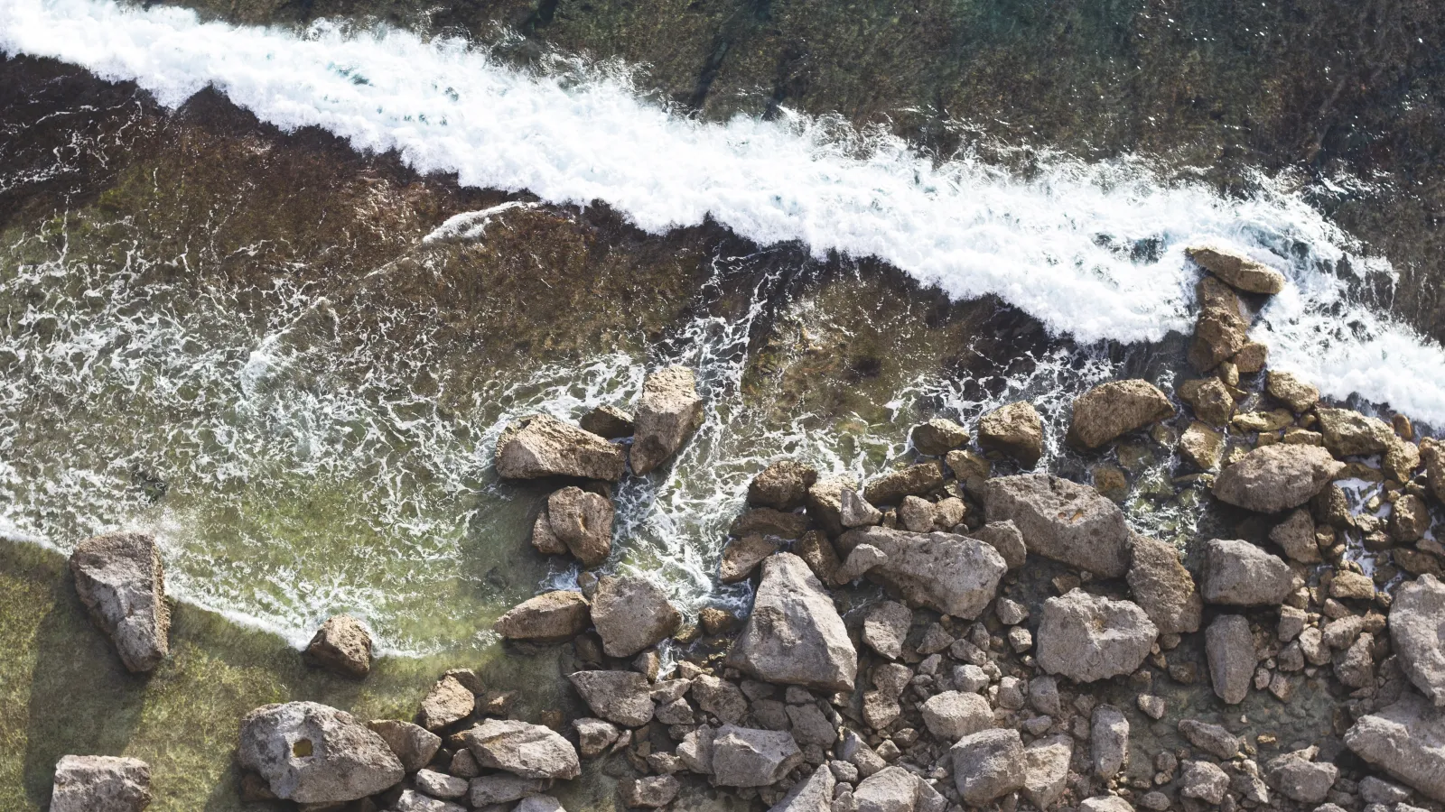 a rocky, ocean shoreline in Guam