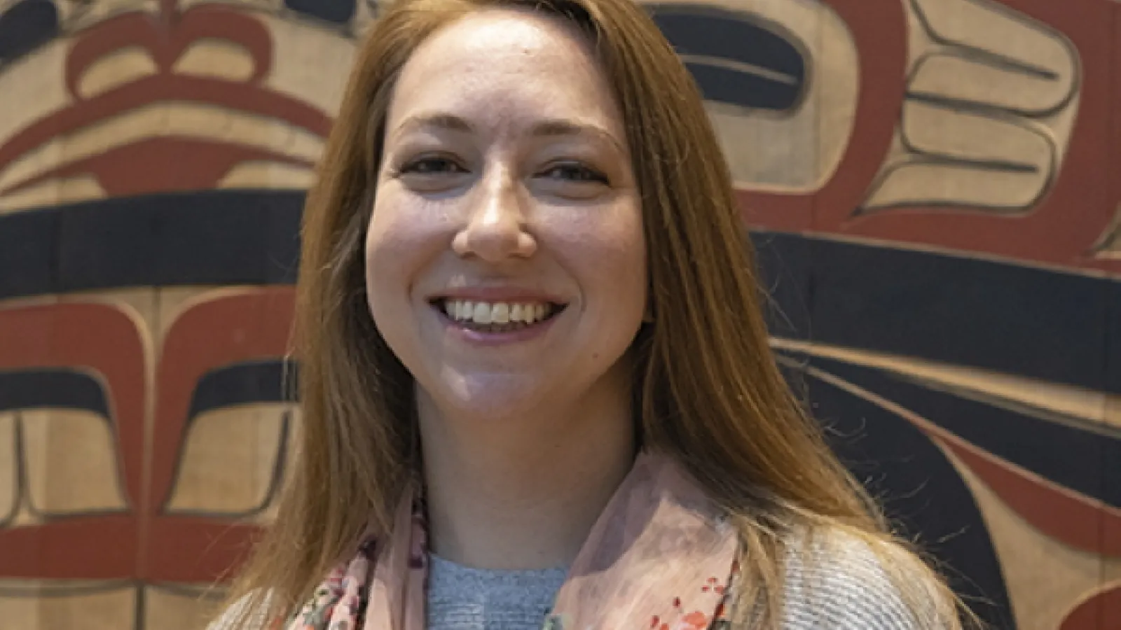Smiling woman with light brown hair