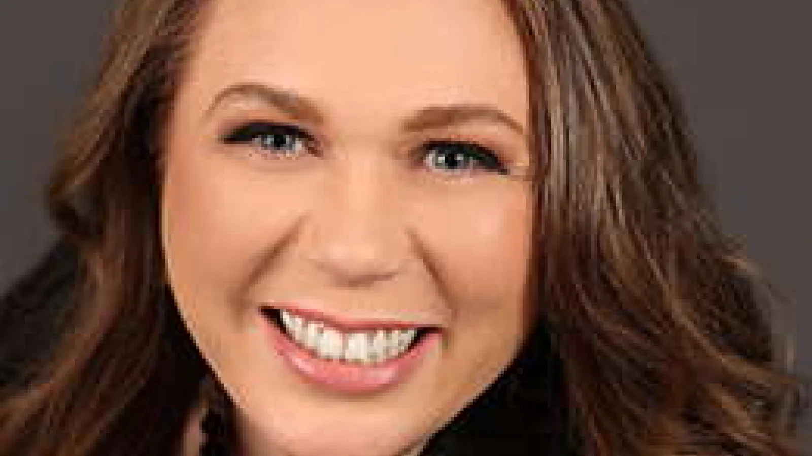 Smiling, long haired brunette woman 