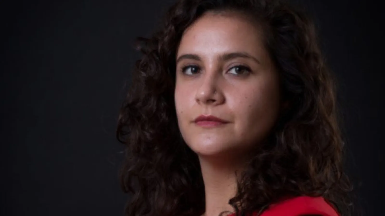Professional headshot photo of Ana Muniz