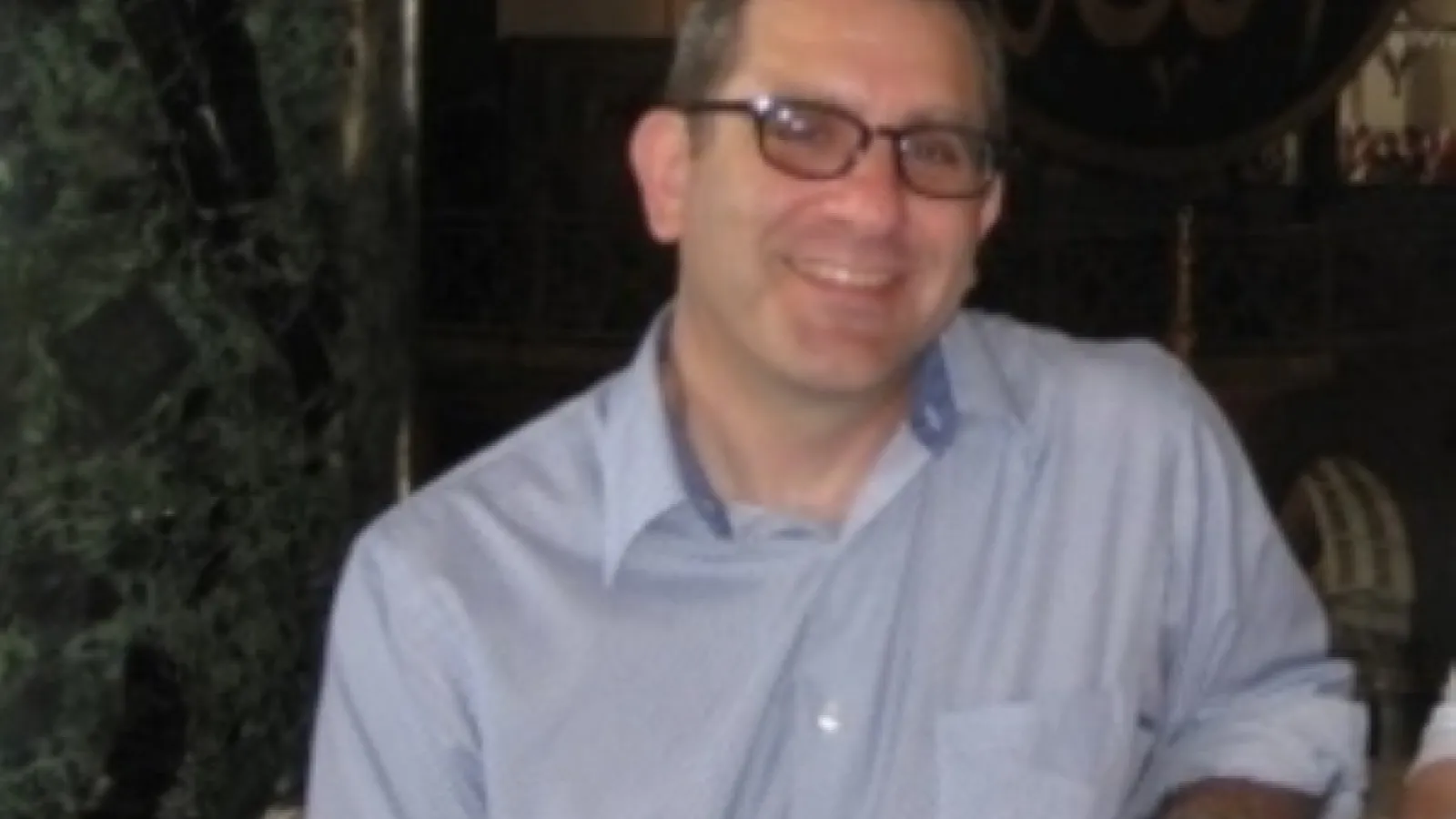Smiling white man wearing glasses