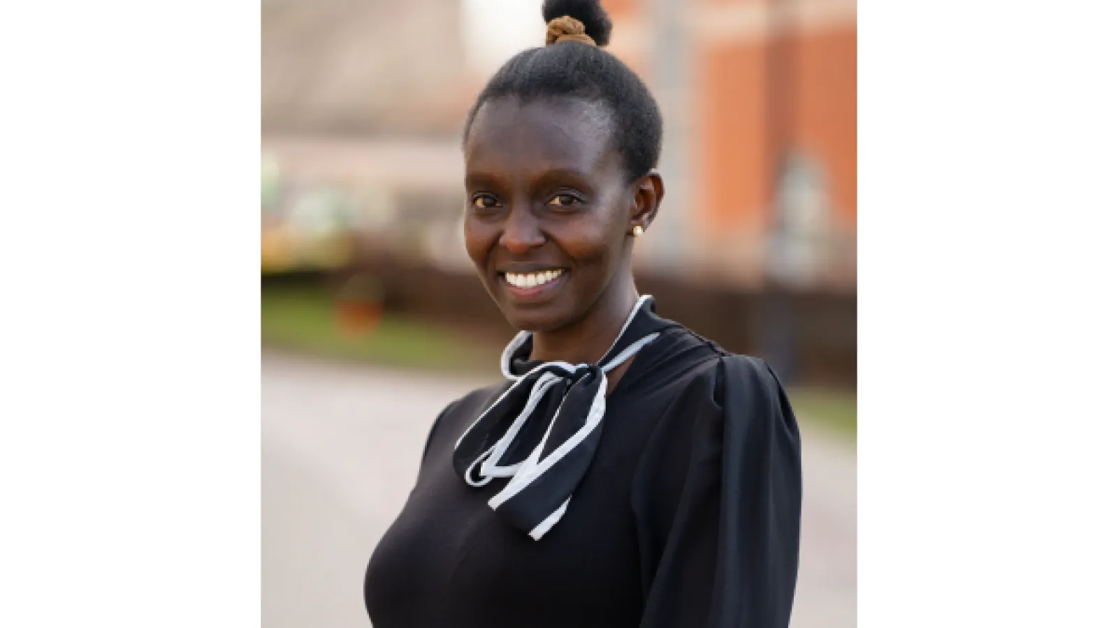 Smiling Black women with hair in bun
