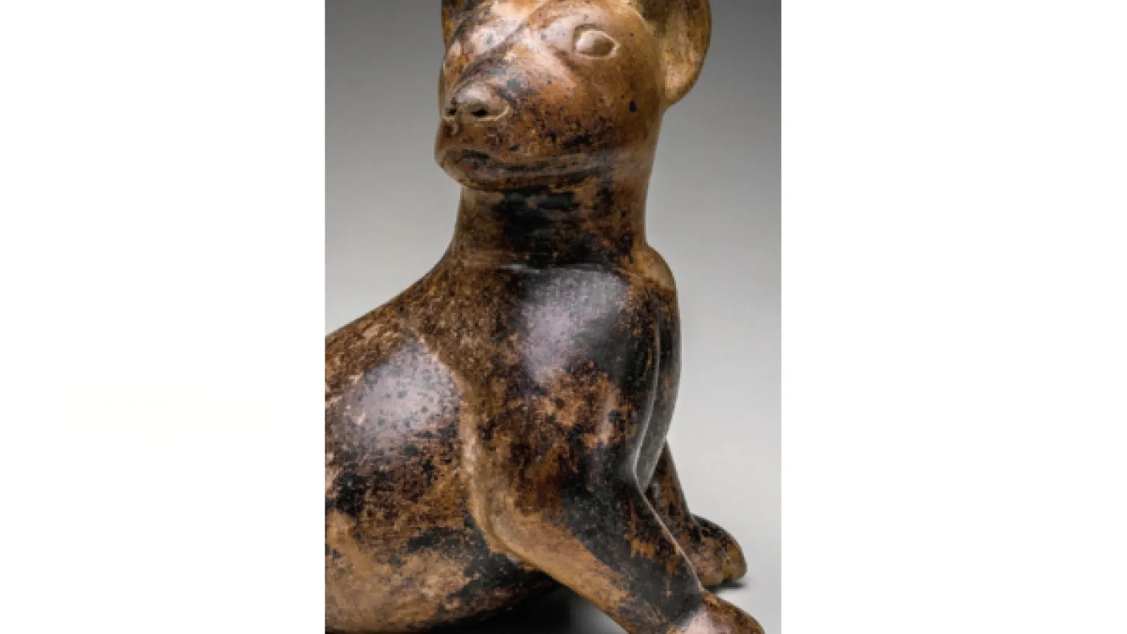 An ancient statue of a dog