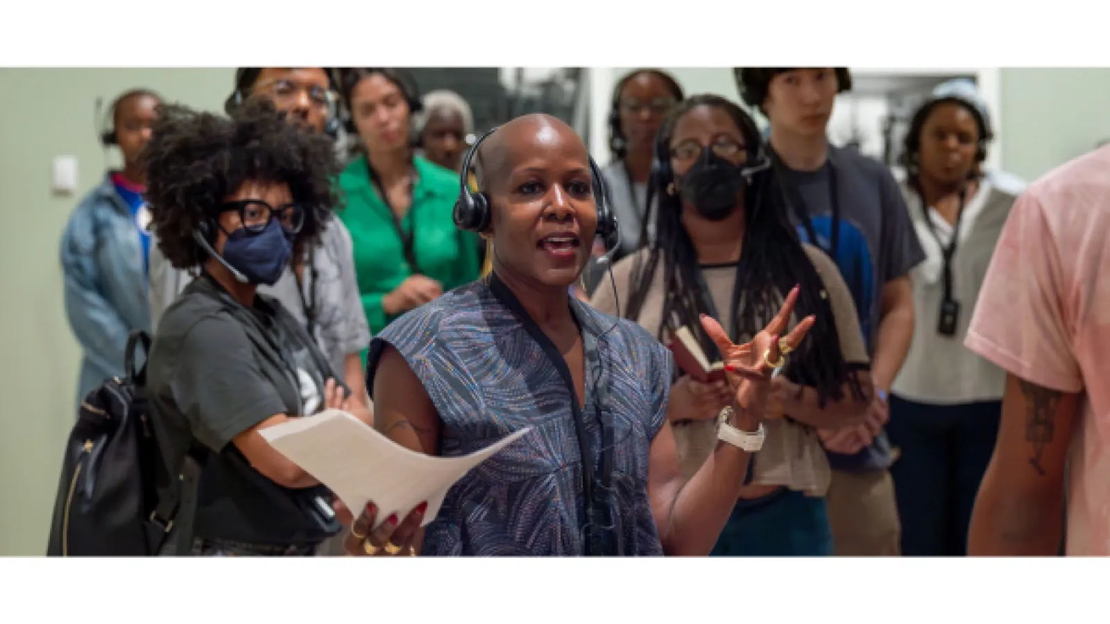 a professor and group of students singing durring class