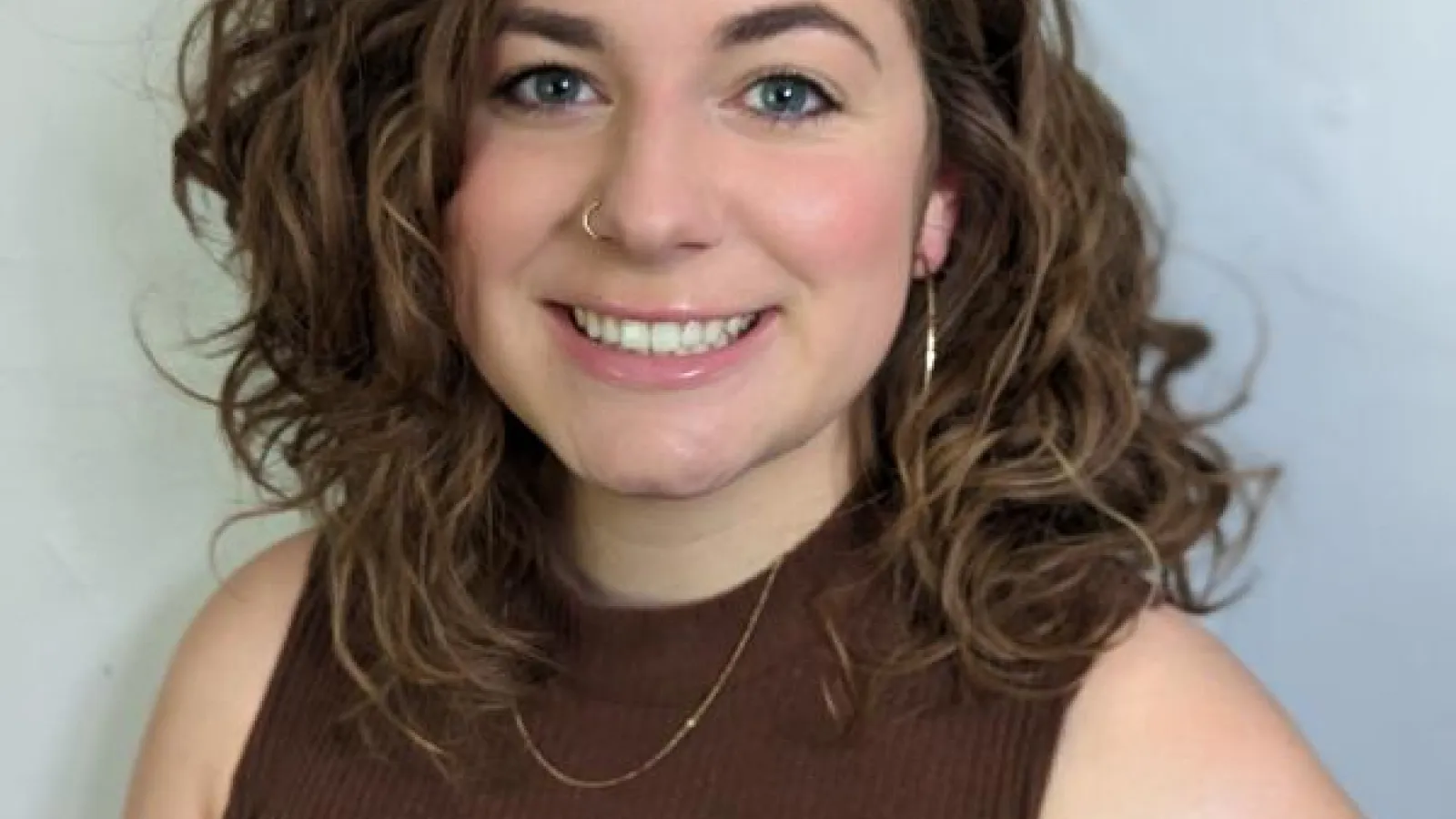 Smiling woman with long brown hair