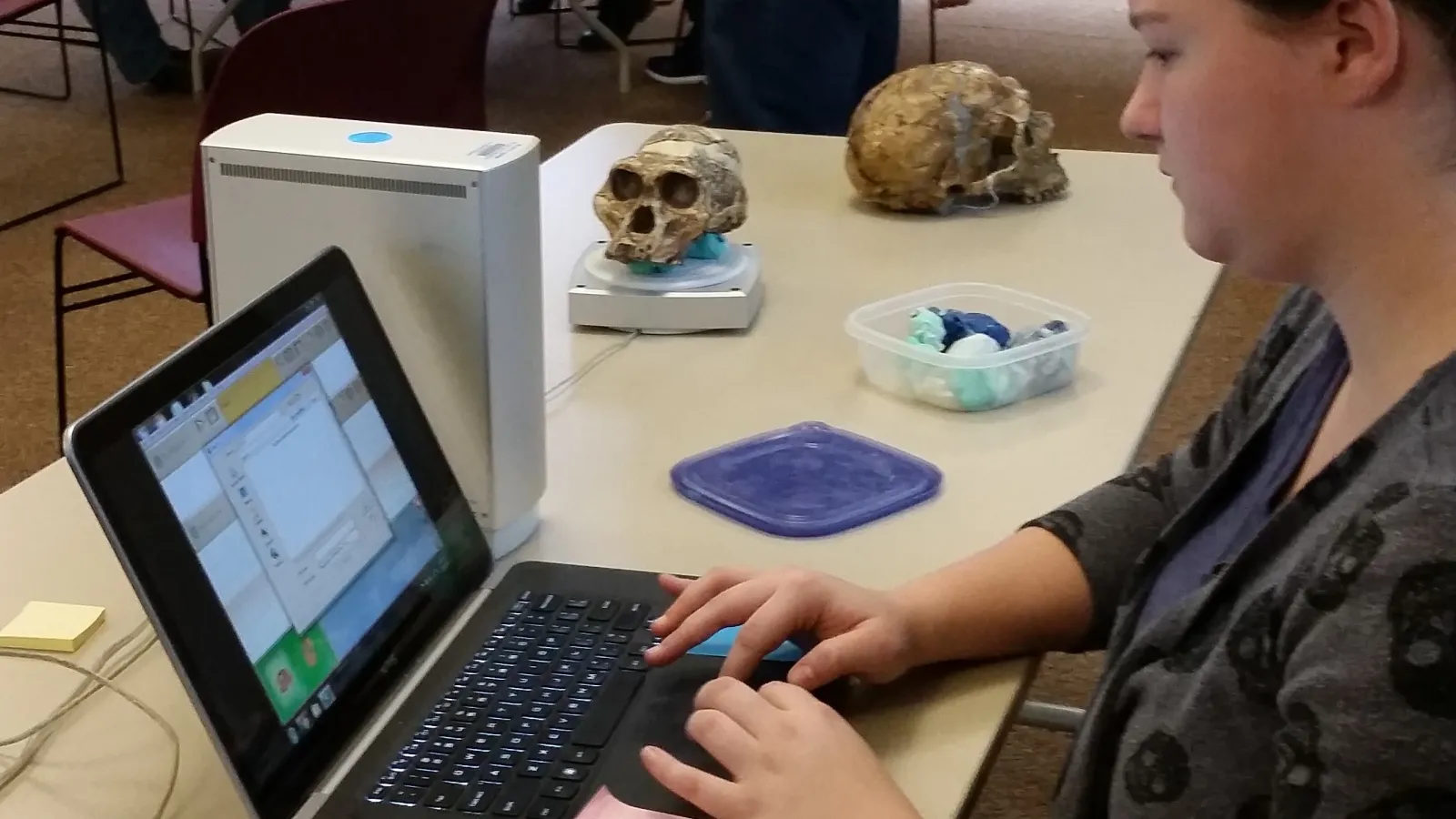Undergraduate student using the 3D scanner