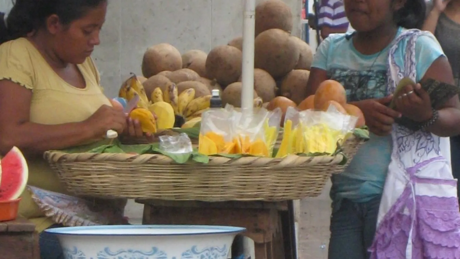 Two women at a market stall
