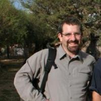 Smiling dark haired bearded man