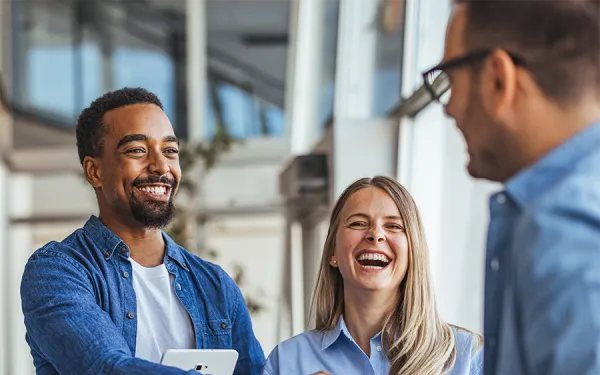 Team members shaking hands in an office