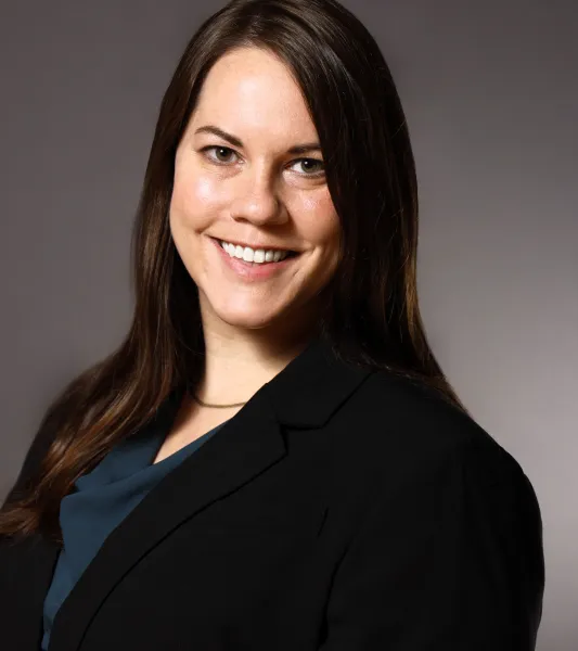 Smiling woman with long dark brown hair