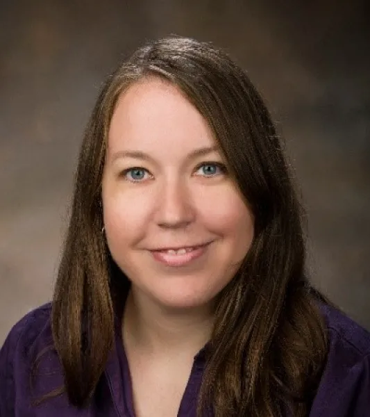 Smiling woman with long brown hair