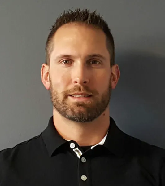 Man with short brown hair and beard
