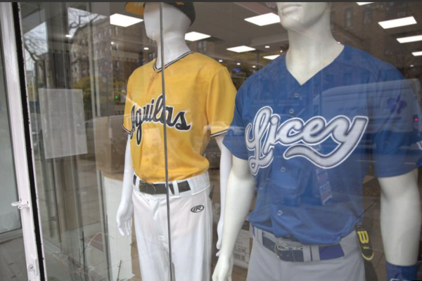 Merchandise for Los Tigres del Licey and Las Águilas Cibaeñas goes on display at Peligro Sports in Washington Heights ahead of a three-day exhibition series at Citi Field. (photo by Verónica Del Valle )