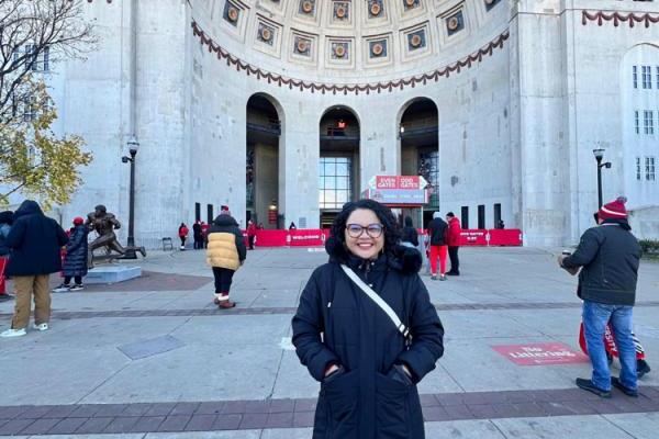 Ana Carolina Brito in front of the OSU football stadium
