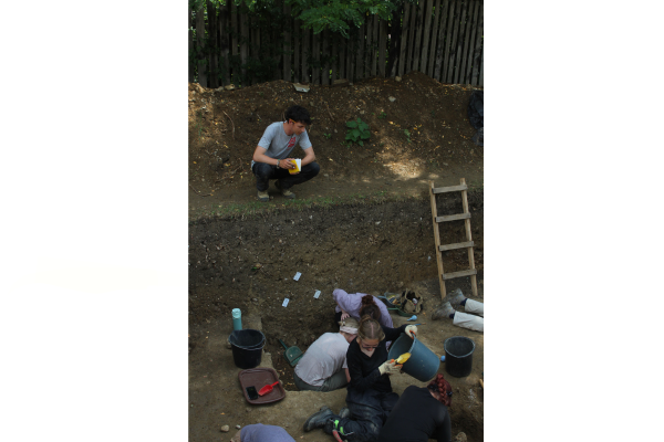 Two students working on the excavation of the St. Nicholas site