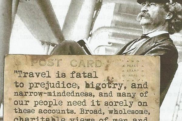 Image of Mark Twain sitting in a deck chair with a quote about travel being fatal to prejudice