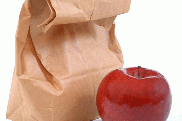 Brown bag with a red apple