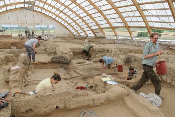 Archaeologists excavate Çatalhöyük by Scott Haddow This image shows archaeologists working on an archaeological excavation at Çatalhöyük