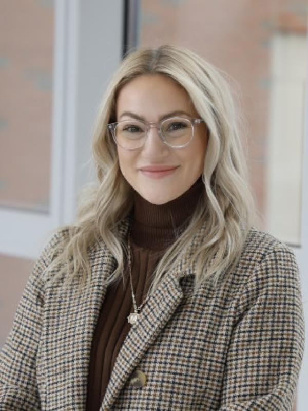 Smiling blonde woman in glasses