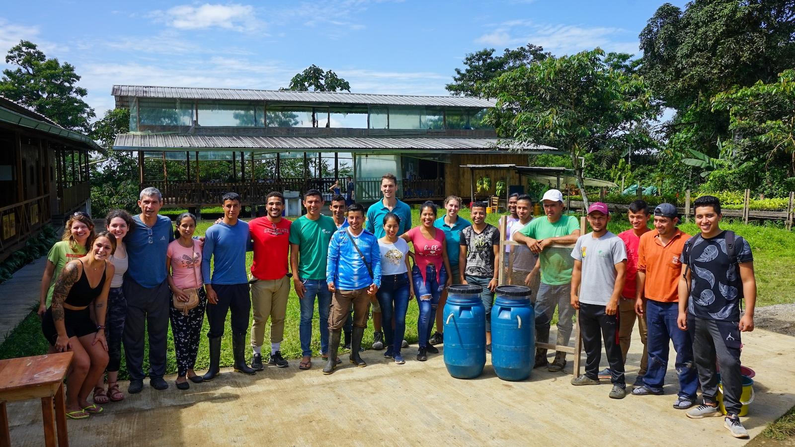 A group of people standing outside a field station in Ecuador