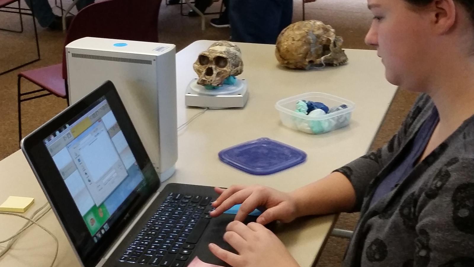 Undergraduate student using the 3D scanner