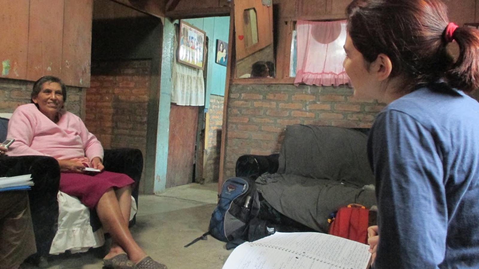 young women talking to older woman