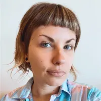 woman with short light brown hair 